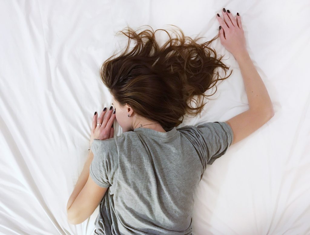 Woman sleeping with a cold